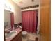 Cozy bathroom with a pedestal sink and shower and bath tub combination at 1344 Cr 437, Lake Panasoffkee, FL 33538