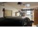 Garage featuring a car, washer and dryer, and ample storage shelving at 1344 Cr 437, Lake Panasoffkee, FL 33538
