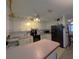 Efficient kitchen featuring white cabinetry, black appliances, and an functional layout for meal preparation at 1344 Cr 437, Lake Panasoffkee, FL 33538