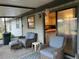 Relaxing porch with comfortable wicker furniture overlooking interior kitchen and outdoor views at 1344 Cr 437, Lake Panasoffkee, FL 33538