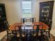 Elegant dining room features a wood table, six chairs, and matching china cabinets, perfect for hosting gatherings at 2154 Wallingford Loop, Mount Dora, FL 32757