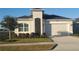Charming single-story home with well-manicured lawn, neat landscaping, and a two-car garage at 2154 Wallingford Loop, Mount Dora, FL 32757
