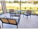 Cozy screened patio, perfect for outdoor lounging, with stylish seating arrangement and privacy fence at 2154 Wallingford Loop, Mount Dora, FL 32757