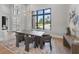 Bright dining area with modern lighting and furniture, offering a seamless transition to the outdoor spaces at 16914 Vinci Way, Bella Collina, FL 34756