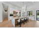 Gourmet kitchen with an expansive marble island, stainless steel appliances, and sleek white cabinetry at 16914 Vinci Way, Bella Collina, FL 34756