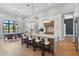 Bright, modern kitchen with a marble island, state-of-the-art appliances, and an open dining area at 16914 Vinci Way, Bella Collina, FL 34756