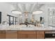 Spacious kitchen featuring a large marble island, stainless steel appliances, and an open floor plan at 16914 Vinci Way, Bella Collina, FL 34756