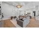Open concept space includes a stylish living area, dining space, and modern kitchen with lots of natural light at 16914 Vinci Way, Bella Collina, FL 34756