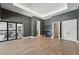 Spacious room features sliding doors with access to outdoor kitchen and bar area at 16914 Vinci Way, Bella Collina, FL 34756