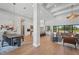 Bright and airy living space featuring open floor plan, modern lighting, and hardwood floors at 16914 Vinci Way, Bella Collina, FL 34756