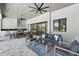 Spacious outdoor living space with outdoor kitchen, dining area and sitting area overlooking pool at 16914 Vinci Way, Bella Collina, FL 34756