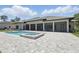 Backyard featuring a sparkling pool, spa, and outdoor living area for entertaining and relaxing at 16914 Vinci Way, Bella Collina, FL 34756