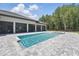 Stunning pool and spa with ample patio space with outdoor dining and summer kitchen nearby at 16914 Vinci Way, Bella Collina, FL 34756