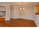 Formal dining room with hardwood floors and a chandelier at 21152 Braveheart Dr, Leesburg, FL 34748