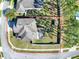 Aerial view of property outlining home, large fenced yard, mature trees and screened in patio at 2150 White Dahlia Dr, Apopka, FL 32712