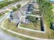 Aerial view of the home featuring a spacious fenced-in backyard, screened in porch, and mature trees at 2150 White Dahlia Dr, Apopka, FL 32712