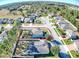 Expansive aerial view showcases a beautiful home with a large, fenced yard in a quiet residential community at 2150 White Dahlia Dr, Apopka, FL 32712