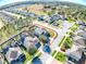 Stunning aerial view of a charming home in a friendly neighborhood, featuring lush landscaping and well-kept surroundings at 2150 White Dahlia Dr, Apopka, FL 32712