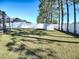 Large backyard with a white fence, tool shed and mature trees providing ample privacy at 2150 White Dahlia Dr, Apopka, FL 32712