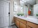 This bathroom has a long vanity with flower decor, modern fixtures, and ample counter space at 2150 White Dahlia Dr, Apopka, FL 32712