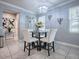 Bright breakfast nook with glass table and white chairs at 2150 White Dahlia Dr, Apopka, FL 32712