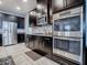 Modern kitchen with stainless steel appliances and dark wood cabinets at 2150 White Dahlia Dr, Apopka, FL 32712