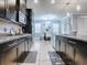 Open kitchen with stainless steel appliances and granite countertops at 2150 White Dahlia Dr, Apopka, FL 32712