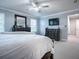 Tranquil main bedroom with neutral colors, ample natural light, dark furniture, and a ceiling fan, creating a relaxing retreat at 2150 White Dahlia Dr, Apopka, FL 32712