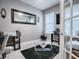 The office is modern with a glass desk and a comfy chair at 2150 White Dahlia Dr, Apopka, FL 32712