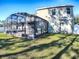 Exterior view of home featuring large screened in patio perfect for enjoying the outdoors at 2150 White Dahlia Dr, Apopka, FL 32712