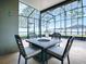 Screened patio with firepit and seating at 2150 White Dahlia Dr, Apopka, FL 32712
