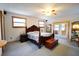 Spacious primary bedroom with a large bed and ample natural light at 3140 Se 23Rd Pl, Sumterville, FL 33585