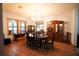 Spacious dining room with hardwood floors and a formal dining set at 3140 Se 23Rd Pl, Sumterville, FL 33585