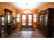 Bright entryway with double doors and hardwood floors at 3140 Se 23Rd Pl, Sumterville, FL 33585
