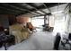 Covered parking area with rocking chairs and storage at 3140 Se 23Rd Pl, Sumterville, FL 33585