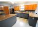 Spacious kitchen with granite countertops and dark cabinets at 3140 Se 23Rd Pl, Sumterville, FL 33585