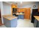 Modern kitchen with granite countertops and wood cabinets at 3140 Se 23Rd Pl, Sumterville, FL 33585