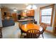 Kitchen features granite countertops and wood cabinets at 3140 Se 23Rd Pl, Sumterville, FL 33585