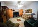 Comfortable living room with a built-in entertainment center and plush seating at 3140 Se 23Rd Pl, Sumterville, FL 33585