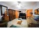 Spacious living room with built-in shelving and comfortable seating at 3140 Se 23Rd Pl, Sumterville, FL 33585