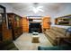 Cozy living room featuring built-in shelving and comfortable seating at 3140 Se 23Rd Pl, Sumterville, FL 33585