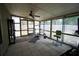 Screened porch with tile floor, and home gym setup at 3140 Se 23Rd Pl, Sumterville, FL 33585