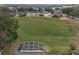 Community overview with homes and a large green area at 4351 Hammersmith Dr, Clermont, FL 34711