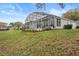 House exterior showcasing a large screened patio at 4351 Hammersmith Dr, Clermont, FL 34711