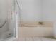 Bathroom features a tub and a shower with glass enclosure at 4351 Hammersmith Dr, Clermont, FL 34711