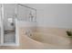 Relaxing bathroom with a large soaking tub and a separate shower at 4351 Hammersmith Dr, Clermont, FL 34711