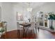 Spacious dining area featuring hardwood floors and large windows at 4351 Hammersmith Dr, Clermont, FL 34711