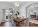Dining room with hardwood floors and a wood table with seating for six at 4351 Hammersmith Dr, Clermont, FL 34711