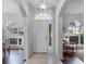Bright and spacious entryway with hardwood floors and arched doorways at 4351 Hammersmith Dr, Clermont, FL 34711