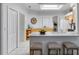 Kitchen with light wood cabinets, white countertops, and an island with seating at 4351 Hammersmith Dr, Clermont, FL 34711